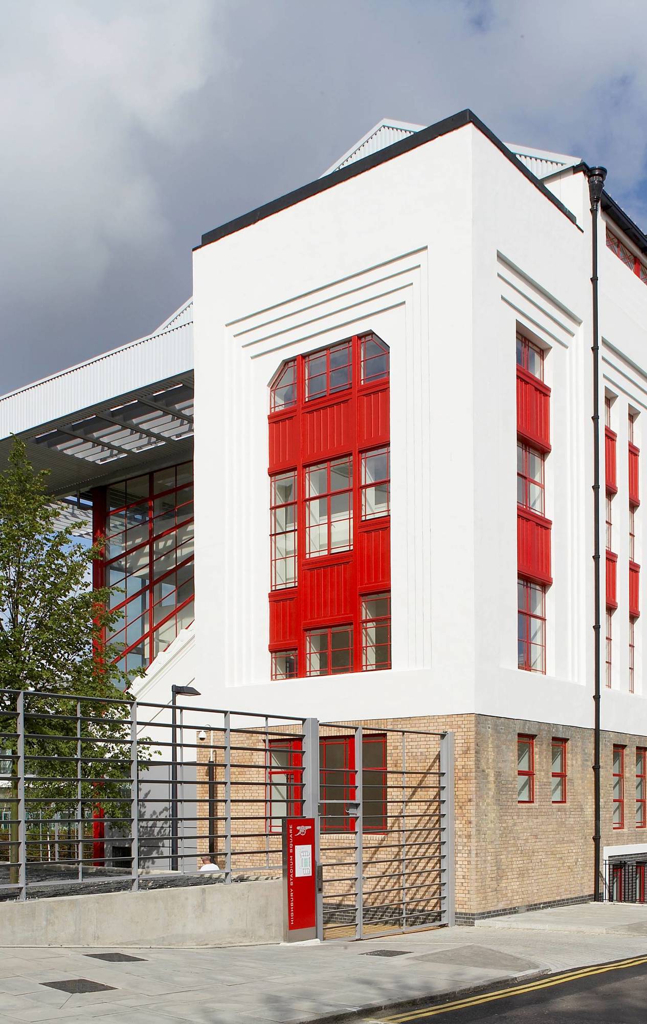 View of the preserved façade at Highbury Square, blending the old iconic structure with new modern residential developments.