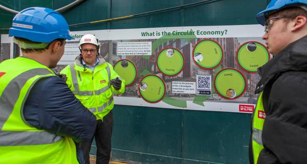 Exterior view of Maggie’s Yorkshire at St James’ University Hospital in Leeds, featuring its trio of interconnected timber pots and landscaped roofs.